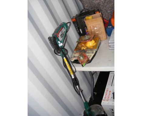 A Black and Decker strimmer, together with a portable rechargeable power station and air compressor and assorted tools