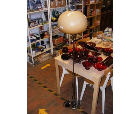 A chrome standard lamp with 'eggshell' shade 