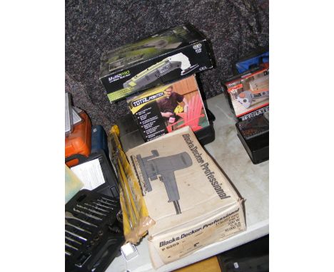 Various tools including a multi-tool, paint spray machine and Black and Decker sander