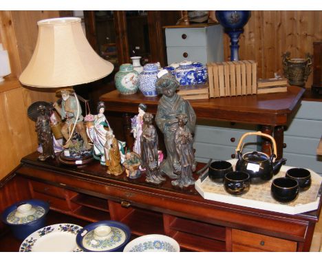 Geisha figurines, together with Japanese teapot, cups and tray, etc. 