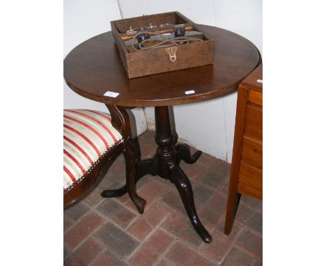 A Georgian circular tripod table