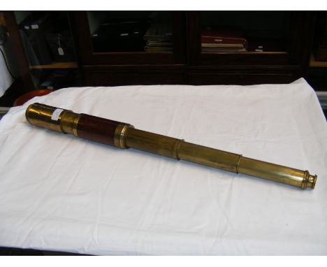 An antique wooden and brass three draw telescope by Thornton, London