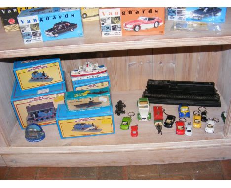 A quantity of Thomas The Tank Engine and Friends - Leonardo Collection ornaments, together with die cast vehicle keyrings, et