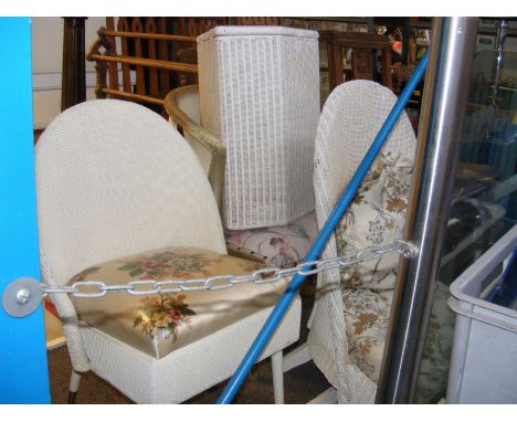 Three Lloyd Loom chairs of varying shape, together with matching laundry basket