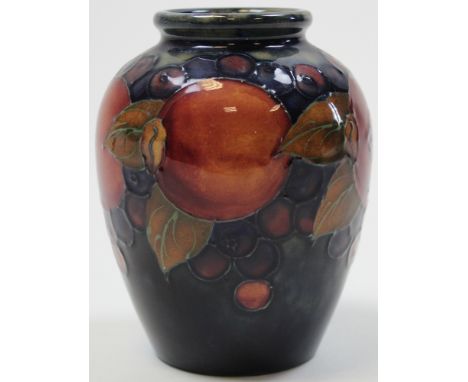 Tubelined moorcroft vase in the pommegranete pattern signed and stamped