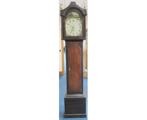 Early 19th century cottage longcase clock with enamel painted dial depicting a hunting scene. Two brass eagle finials.