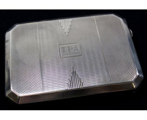 Silver cigarette case of rectangular form, hallmarked Birmingham 1933, engine turned decoration and "T.P.A June 15th 1934" in