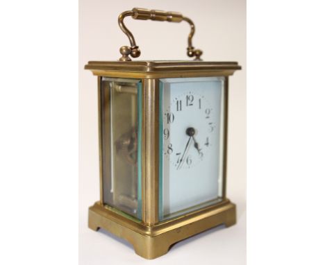 French Five glass gilt brass carriage clock with repeater, the white face with black Arabic numerals over a subsidiary alarm 