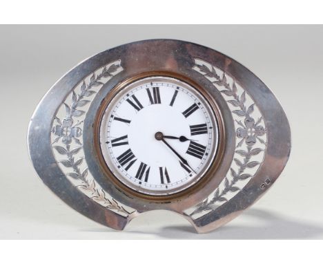 Silver Mappin & Webb desk clock, Birmingham 1913, the oval silver frame surrounding a white enamel dial, presentation engravi