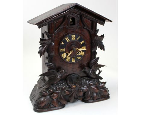 19th Century Black Forest Cuckoo Bracket Clock. Carved with Birds either side of a nest and with a twin bellows movement stri