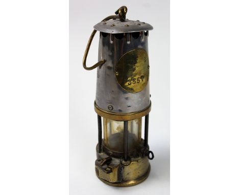 Miners lamp 'The protector lamp and lighting company by Eccles number 3557. Standing 24 cm high