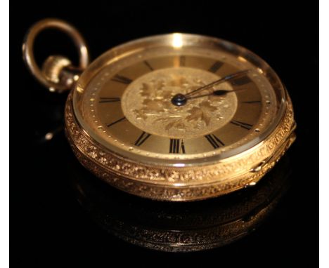 Ladies 18ct gold pocket watch the gilt dial with black roman numerals, foilate design in centre and on the back of the case