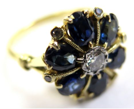 18ct/Plat ring with central Diamond surrounded by 6 oval Sapphires and small Diamonds size O weight 4.8 grams