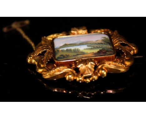 Yellow metal Brooch with safety chain with central enamel plaque depicting a mountain/meadow scene 