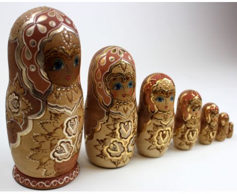 Vintage hand made matryoska set of nesting dolls, seven in total signed and with inscription. Standing 21.5 cm tall and highl