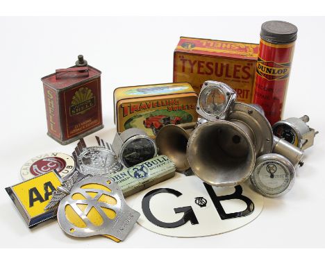 A box of vintage motoring memorabilia including various parts, cans, badges etc