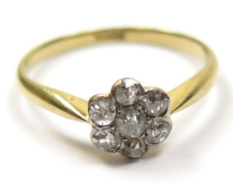 18ct Ring with Diamonds set in a floral pattern size N weight 1.9 grams 