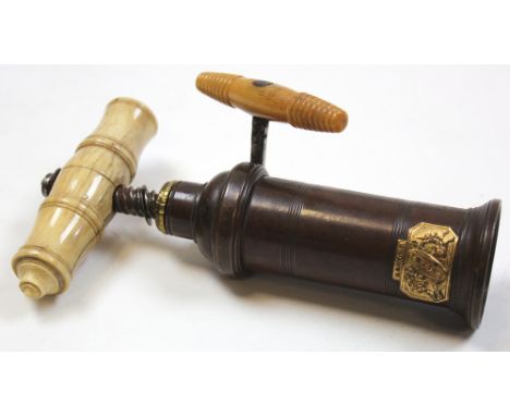 A 19th century corkscrew by dowler made of brass with a bone handle. The screw itself being snapped. Another by Heeley and so