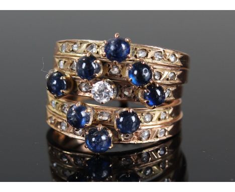 Yellow metal 5 piece puzzle ring set with Diamonds and Sapphires size L weight 7.7 grams
