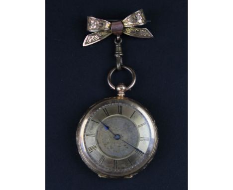 Gold plated Ladies open face pocket watch on an ornate Bow brooch pin, Gilt dial with Roman numerals