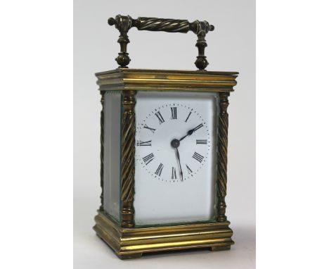 Five glass brass carriage clock with black Roman numerals on a white face approx height not including handle 11cm (key includ