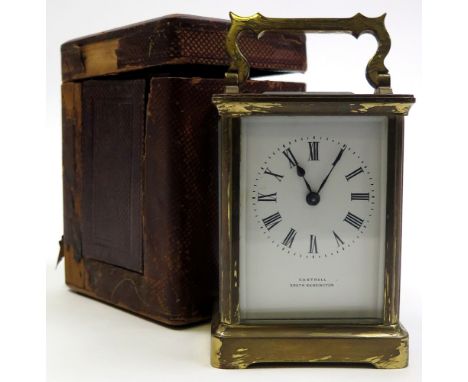 Brass framed five glass carriage clock with black Roman numerals on a white face "Castrell South Kensington" Approx height 10