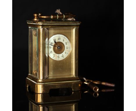 Miniature brass carriage clock stamped DH france complete with key