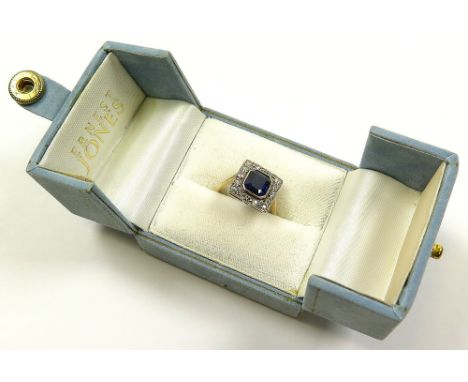 18ct ring with central baguette Sapphire surrounded by Diamonds size L weight 2.7 grams