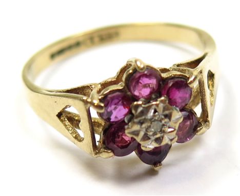 9ct Ring set with Diamond and Rubies in a floral pattern size N weight 2.4 grams