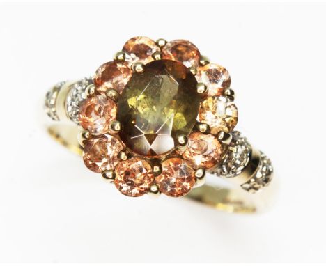 A hallmarked 9ct gold andalusite cluster ring, gross wt. 3.2g, size R.  