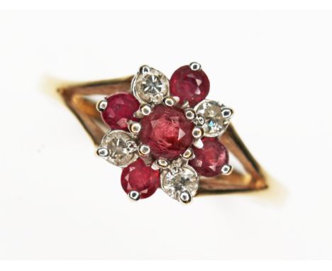 A hallmarked 9ct gold diamond and ruby cluster ring, gross wt. 1.44g, size J.  