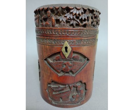 A 19th century Chinese carved bamboo tea caddy with brass lock, height 17cm. 