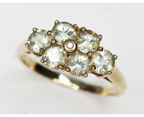 A hallmarked 9ct gold amblygonite cluster ring, gross wt. 2.7g, size Q/R.  