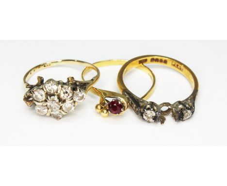 A group of three rings comprising a diamond cluster ring indistinctly marked, a hallmarked 18ct gold diamond ring and a hallm