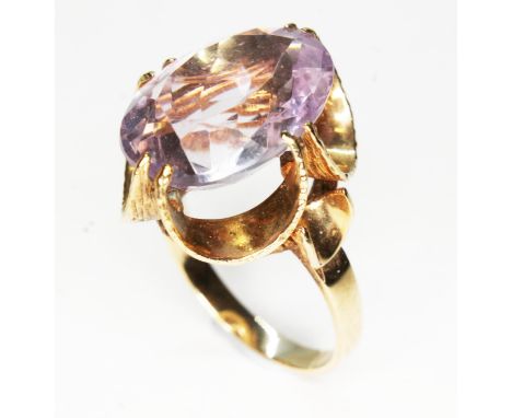 A hallmarked 9ct gold ring set with an oval mixed cut amethyst weighing approx. 8ct, gross wt. 5g, size K.  
