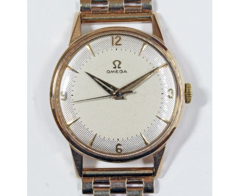 A 9ct gold Omega watch, circa 1956, cal. 284, diameter 32mm, signed textured two tone dial, sword hands and centre seconds, 1