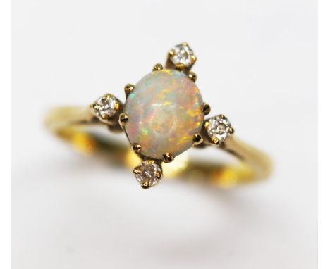 An opal and diamond ring, unmarked band, probably 18ct, gross wt. 3.2g, size M.&nbsp;Condition - good, opal appears free from