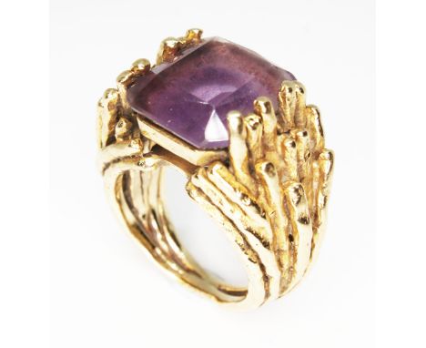 A Brutalist style cast hallmarked 9ct gold ring set with an emerald cut amethyst, Deakin &amp; Francis, gross wt. 16.1g, size