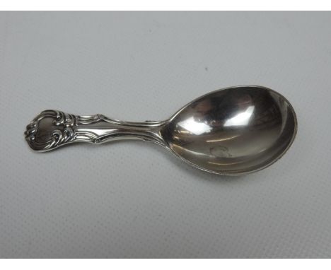 A Victorian Silver Caddy Spoon in the Victoria Pattern, not engraved. The spoon is hallmarked for London 1860 by Samuel Hayne