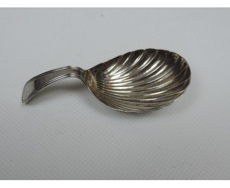 An 18th Century George III Silver Caddy Spoon, shell bowl, thread handle, not engraved. The spoon is hallmarked for London 17