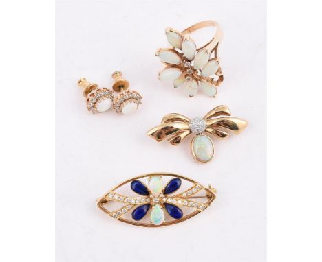 
	
		A COLLECTION OF OPAL SET JEWELLERY
		Comprising a diamond and opal dress ring, the brilliant cut diamond accents with a 