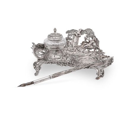 
	
		A SILVER SHAPED OVAL INKSTAND
		SPONSORS MARK FOR EDWIN THOMPSON BRYANT, IMPORT MARK FOR LONDON 1895
		Pierced and embos