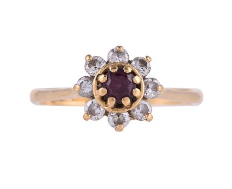 
	
		A RUBY AND DIAMOND CLUSTER RING  
		LONDON 1979 IMPORT MARKS 
		The circular cut ruby within a surround of brilliant cut