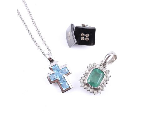 
	
		AN 18 CARAT WHITE GOLD AND BLUE TOPAZ CROSS PENDANT ON CHAIN 
		LONDON 2000
		The polished cross set with step cut blue 