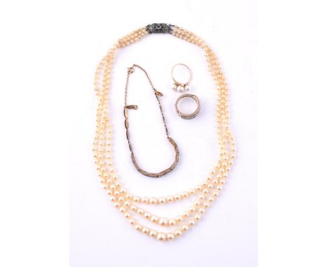 
	
		MIKIMOTO, A THREE CULTURED PEARL RING
		The three graduated cultured pearls to a polished shank, stamped 14k with Mikimo