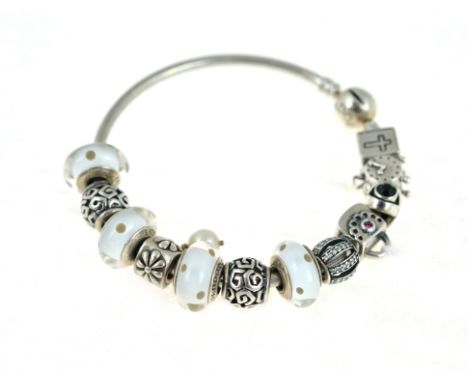 PANDORA - A silver Pandora bangle, with twelve Pandora charms, approx gross weight 43.6gms