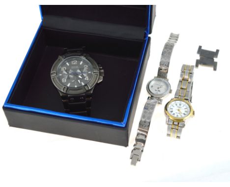 Three quartz wristwatches to include a gents Guess in box together with two ladies, a Rotary &amp; Coach, all working