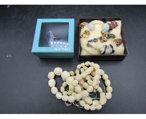 7 pairs clip on earrings, a ring and carved bone beaded necklace with spare beads