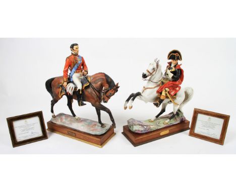 Two Royal Worcester ceramic figures of Napoleon Bonaparte and the Duke of Wellington, both sitting on horseback with detachab
