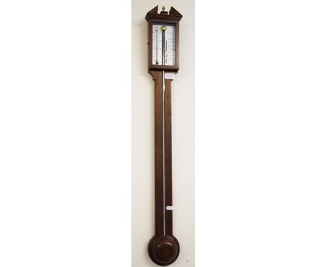 A 20th Century oak cased barometer and thermometer combination by Woodford.